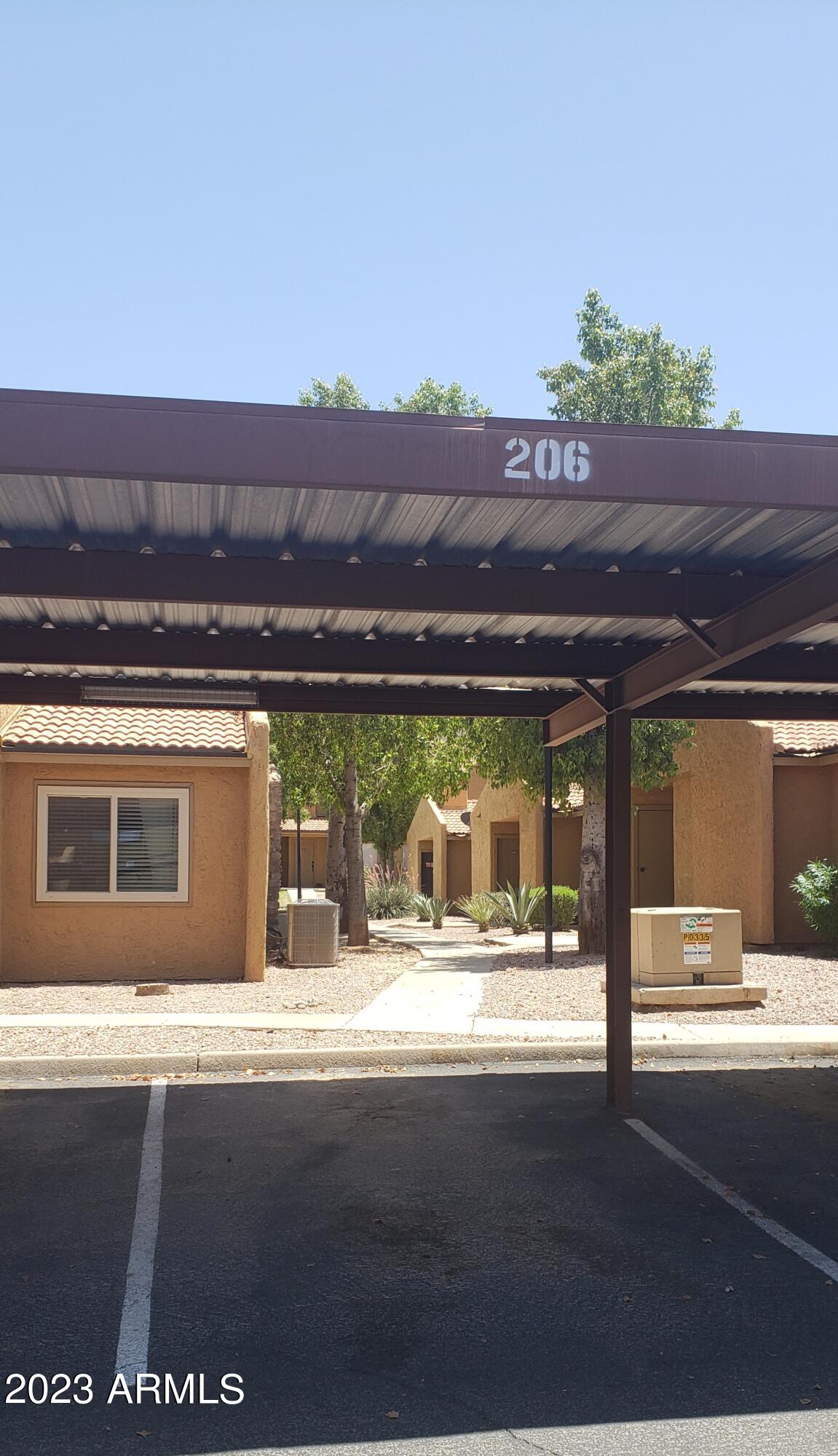 3511 East Baseline Road, Unit 1057 Phoenix, AZ 85042 - Photo 23 of 30 an outdoor view of house with a yard