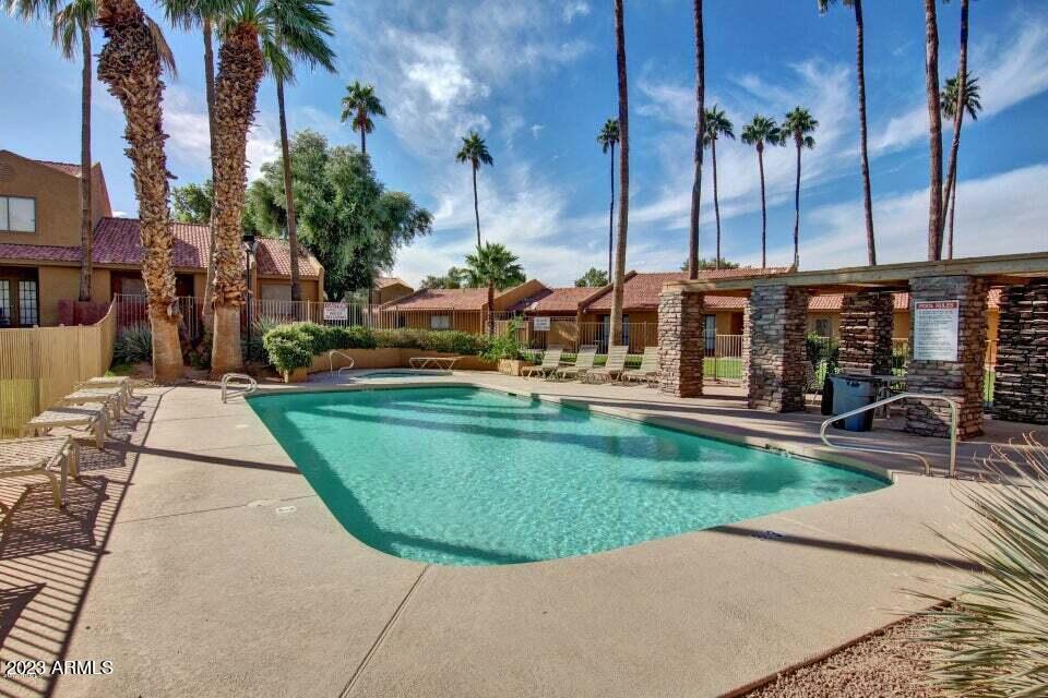 3511 East Baseline Road, Unit 1057 Phoenix, AZ 85042 - Photo 25 of 30 an aerial view of a house with a yard table and chairs