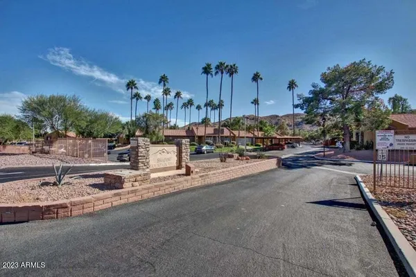 an aerial view of a house with swimming pool garden and patio