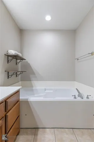 a bathroom with a bathtub and a sink