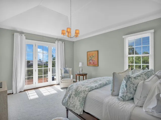 a bed room with a bed and a large window