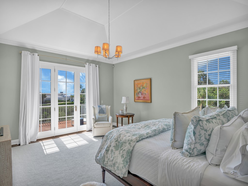 986 Riomar Drive Vero Beach, FL 32963 - Photo 20 of 36 a bed room with a bed and a large window