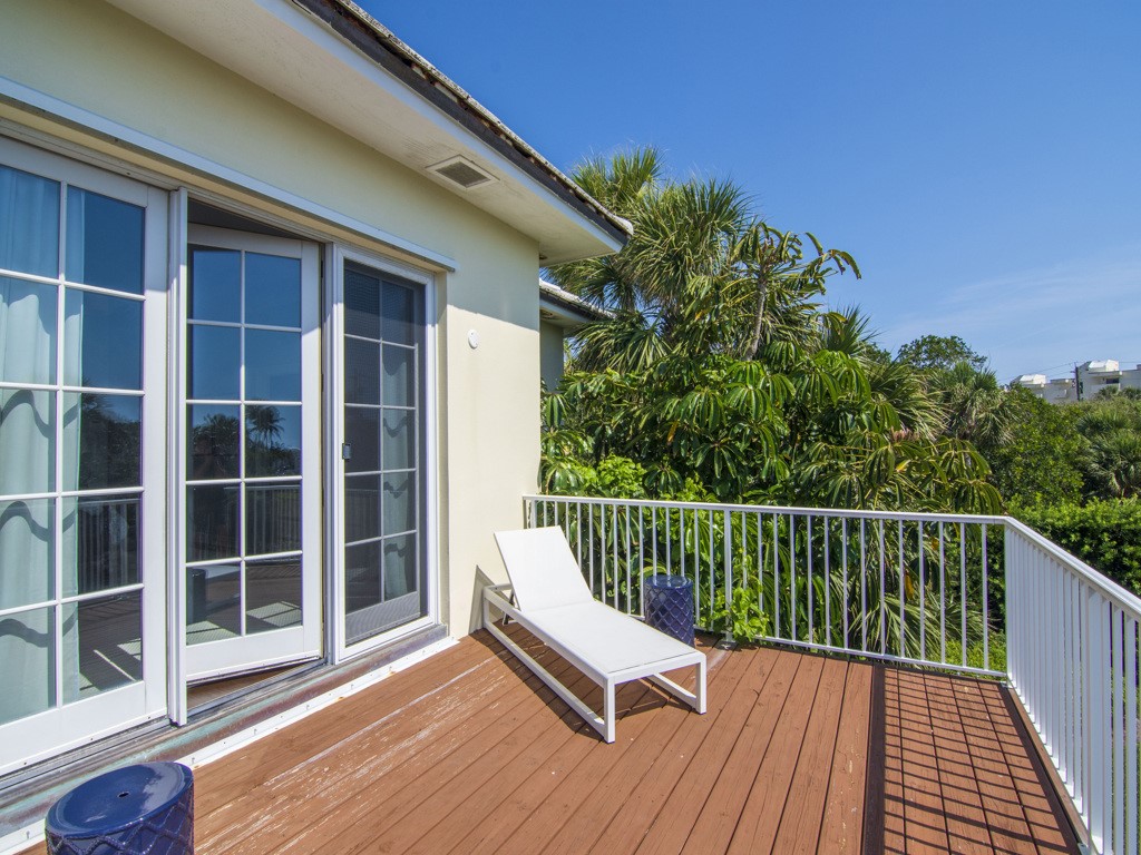 986 Riomar Drive Vero Beach, FL 32963 - Photo 24 of 36 a view of balcony with wooden floor and fence