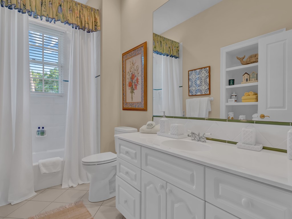986 Riomar Drive Vero Beach, FL 32963 - Photo 28 of 36 a bathroom with a sink and a mirror