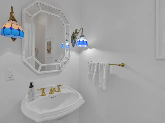 a bathroom with a sink and a window