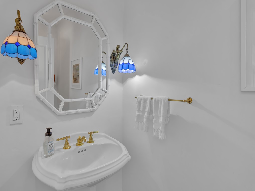 986 Riomar Drive Vero Beach, FL 32963 - Photo 29 of 36 a bathroom with a sink and a window