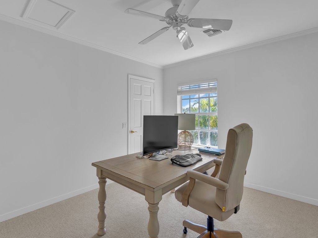 986 Riomar Drive Vero Beach, FL 32963 - Photo 36 of 36 a view of a workspace with furniture and a window