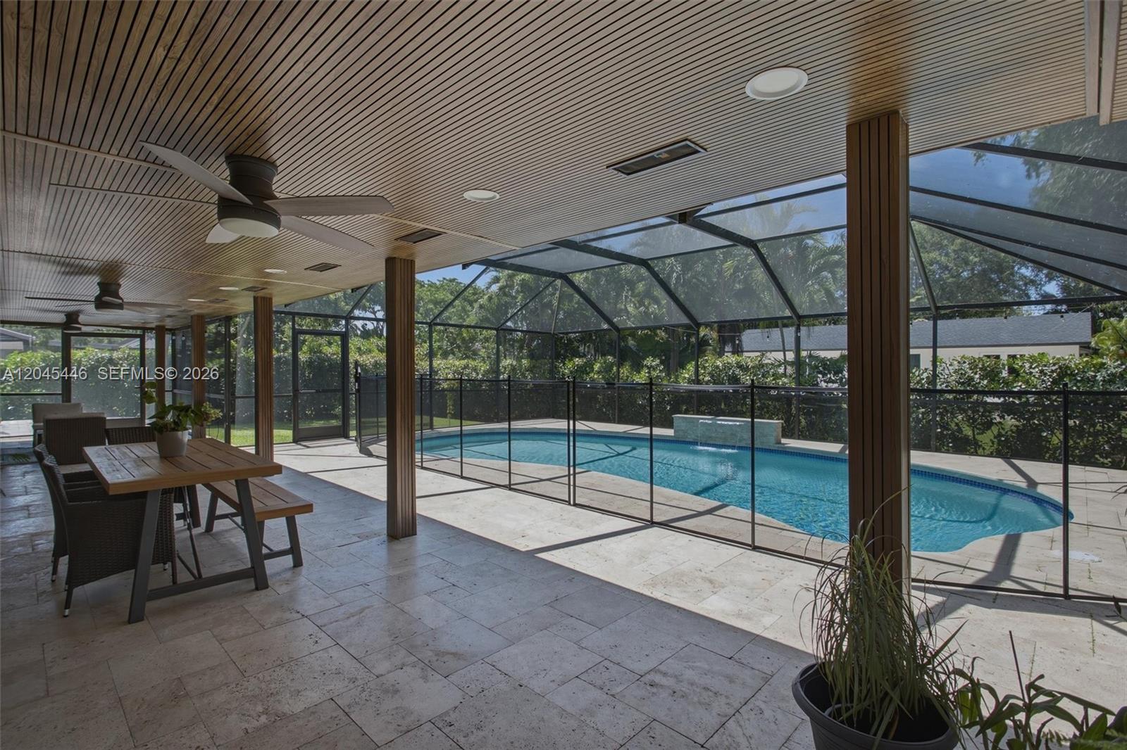 8440 Southwest 180th Street Palmetto Bay, FL 33157 - Photo 36 of 54 a view of a patio with table and chairs