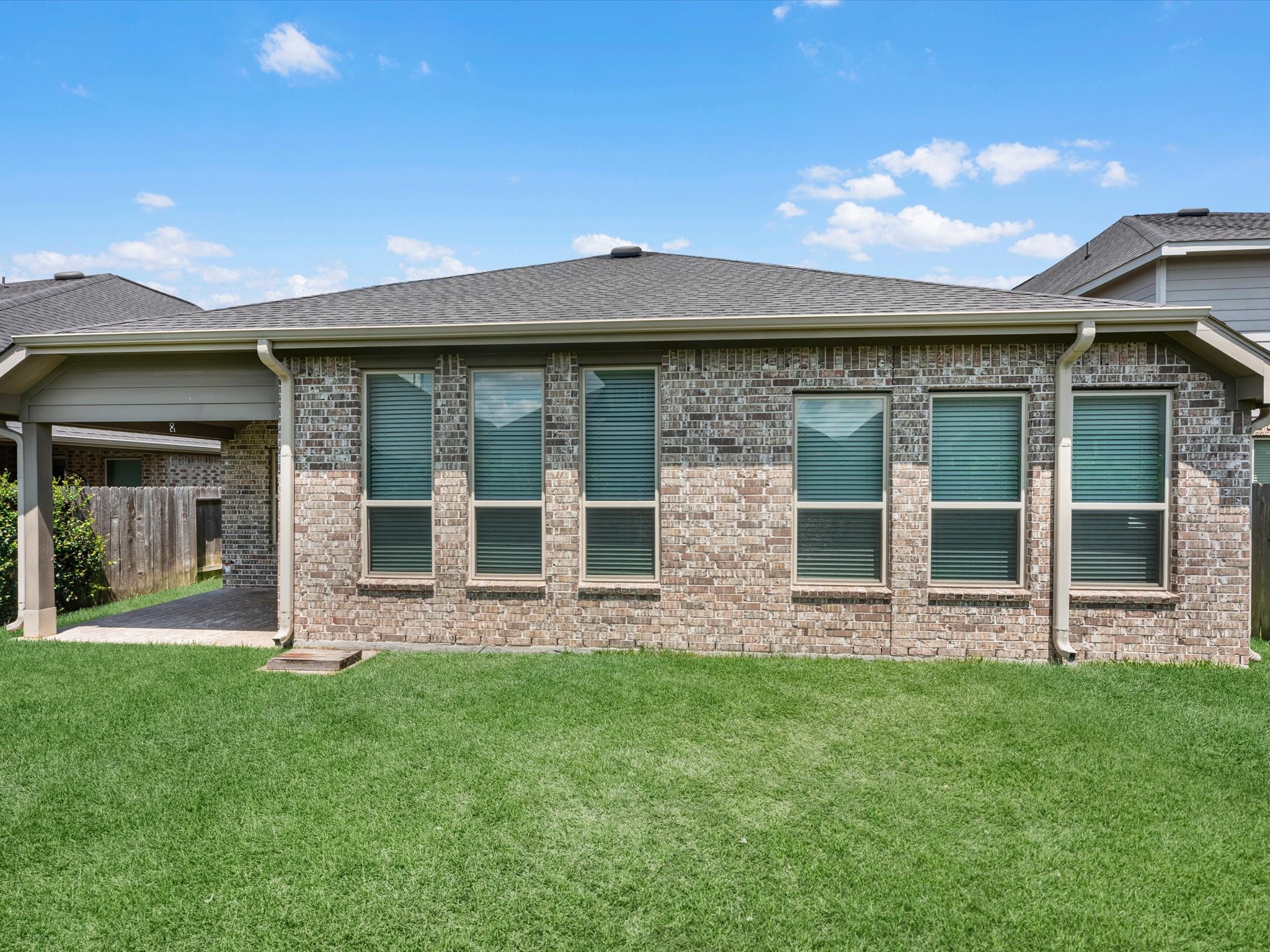 31120 Aspen Gate Trail Spring, TX 77386 - Photo 30 of 33 front view of a brick house with a yard