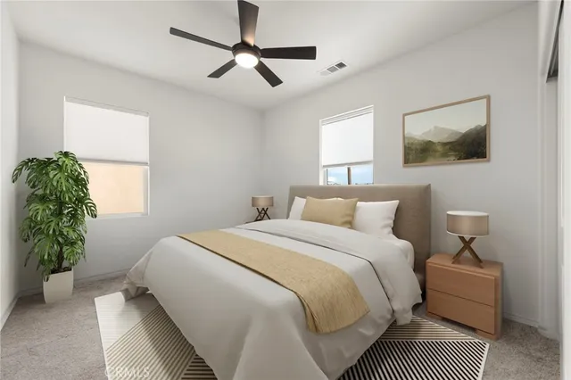 a bedroom with bed and a window