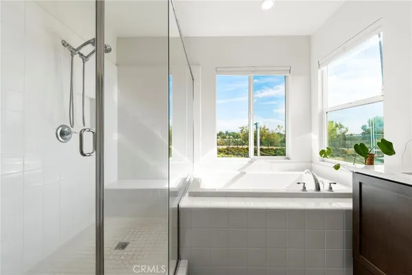 a bathroom with a bathtub and a sink