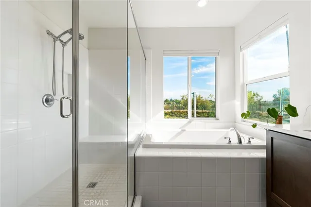 a bathroom with a bathtub and a sink