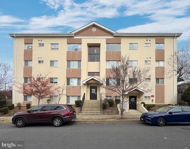 a front view of a house with parking