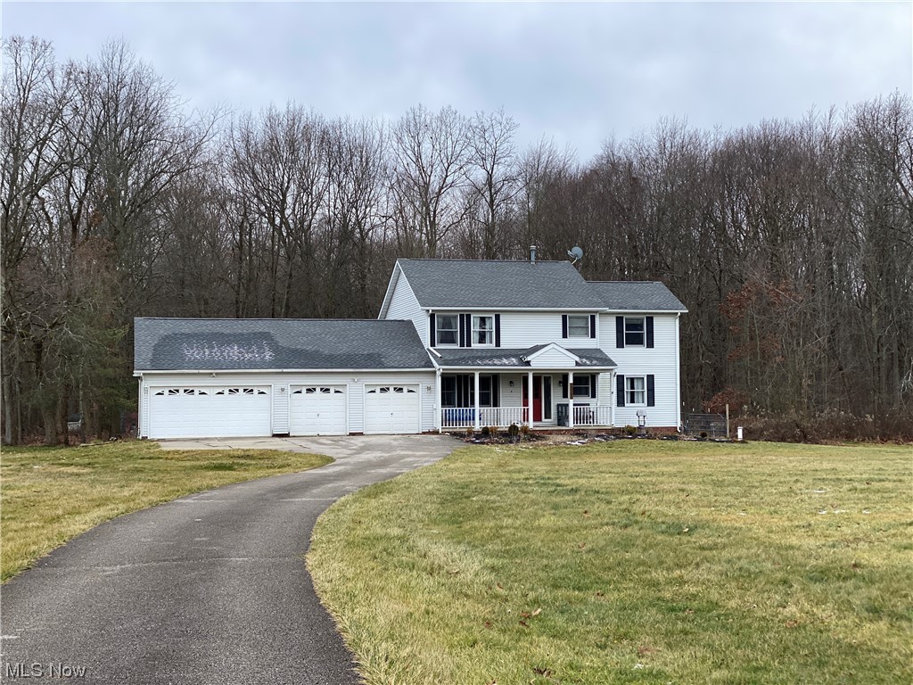 16560 Old State Road Middlefield, OH 44062 - Photo 1 of 15 16560 Old State Road framed by rear woods