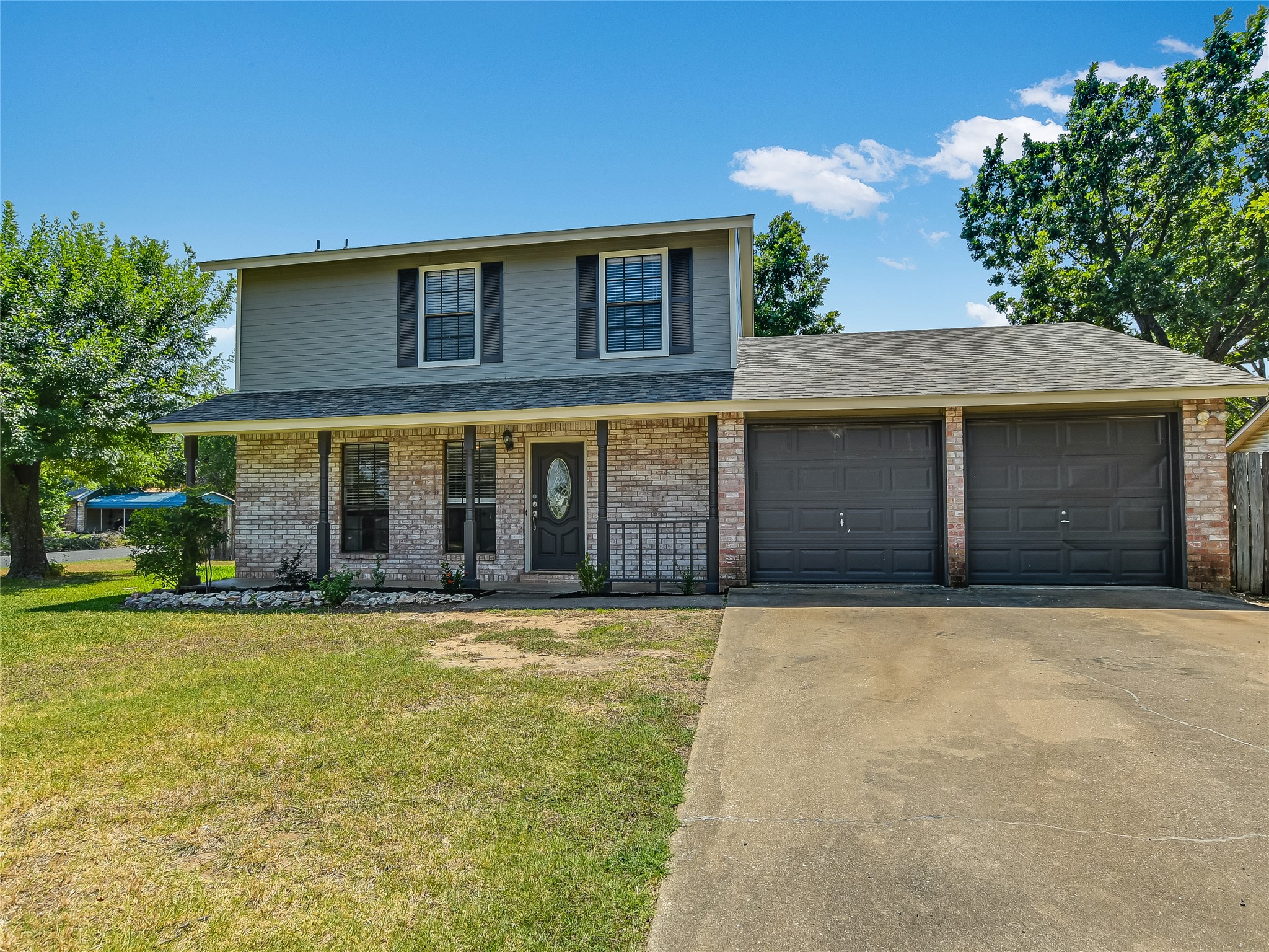 300 North Field Street Round Rock, TX 78681 - Photo 3 of 26 Cute curb appeal with covered front porch.