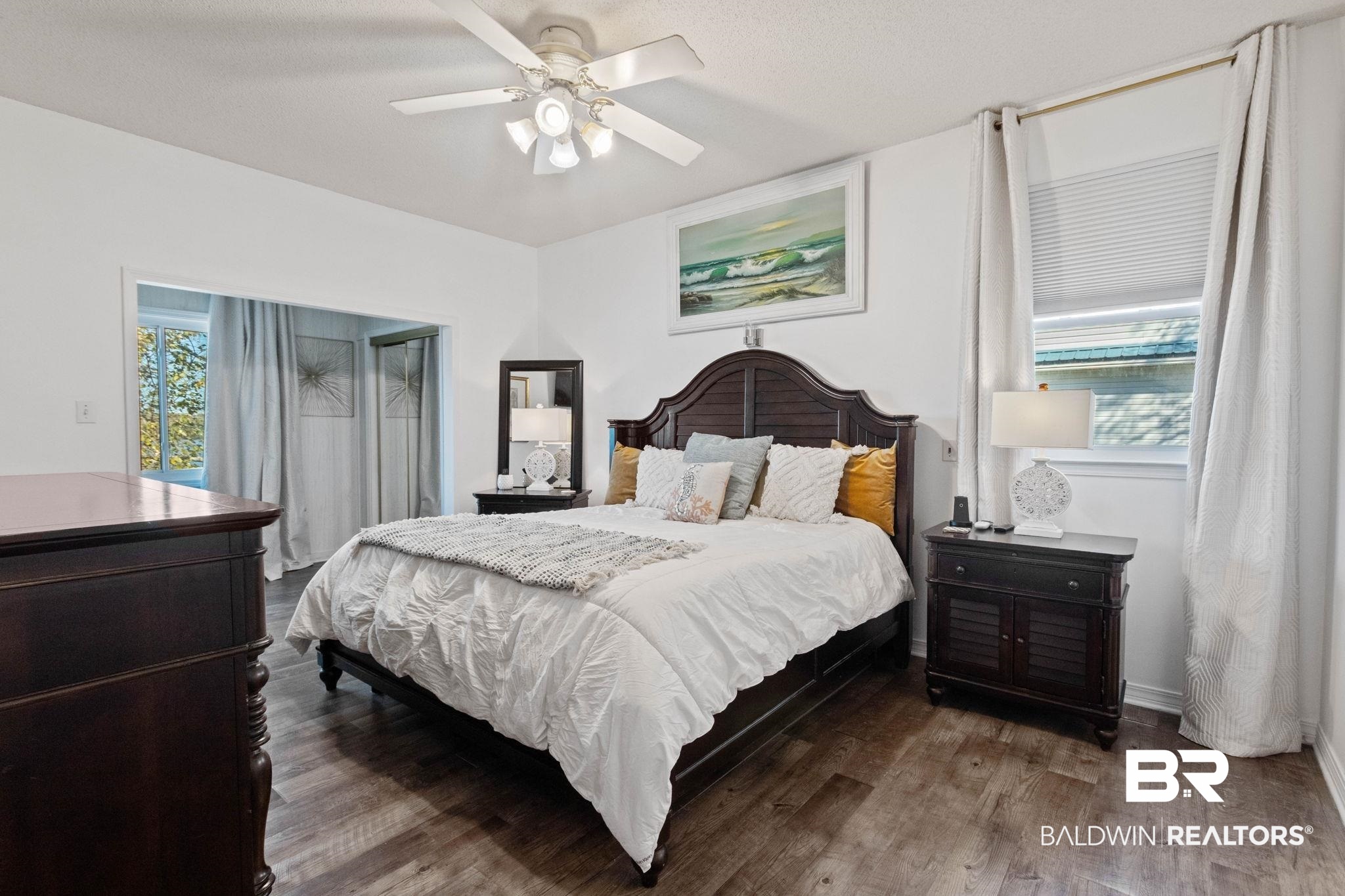 41997 Bayou Road Bay Minette, AL 36507 - Photo 19 of 68 Bedroom featuring wood finished floors, ceiling fan, and an abundance of natural light