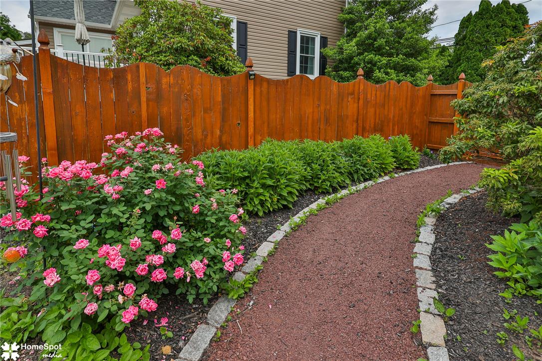 2821 Center Street Bethlehem, PA 18017 - Photo 62 of 68 A private fence borders a winding path and a vibrant rose garden.