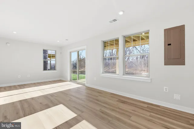 a bathroom with a sink mirror and toilet