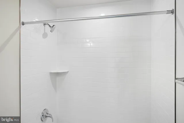 a view of a kitchen with wooden floor and electronic appliances