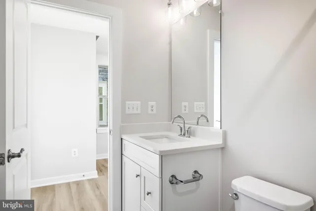 a kitchen with stainless steel appliances granite countertop a refrigerator sink and stove