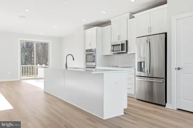 a bathroom with a sink a mirror and a shower