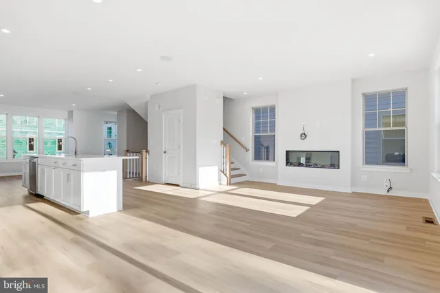 an empty room with ceiling fan