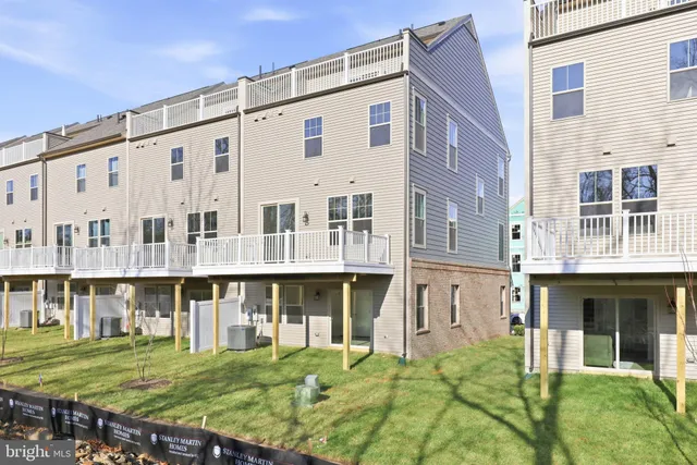 a front view of a building with a garden