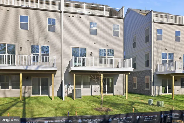 a view of staircase with white walls and windows