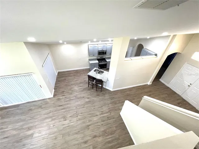 a living room with furniture and white walls