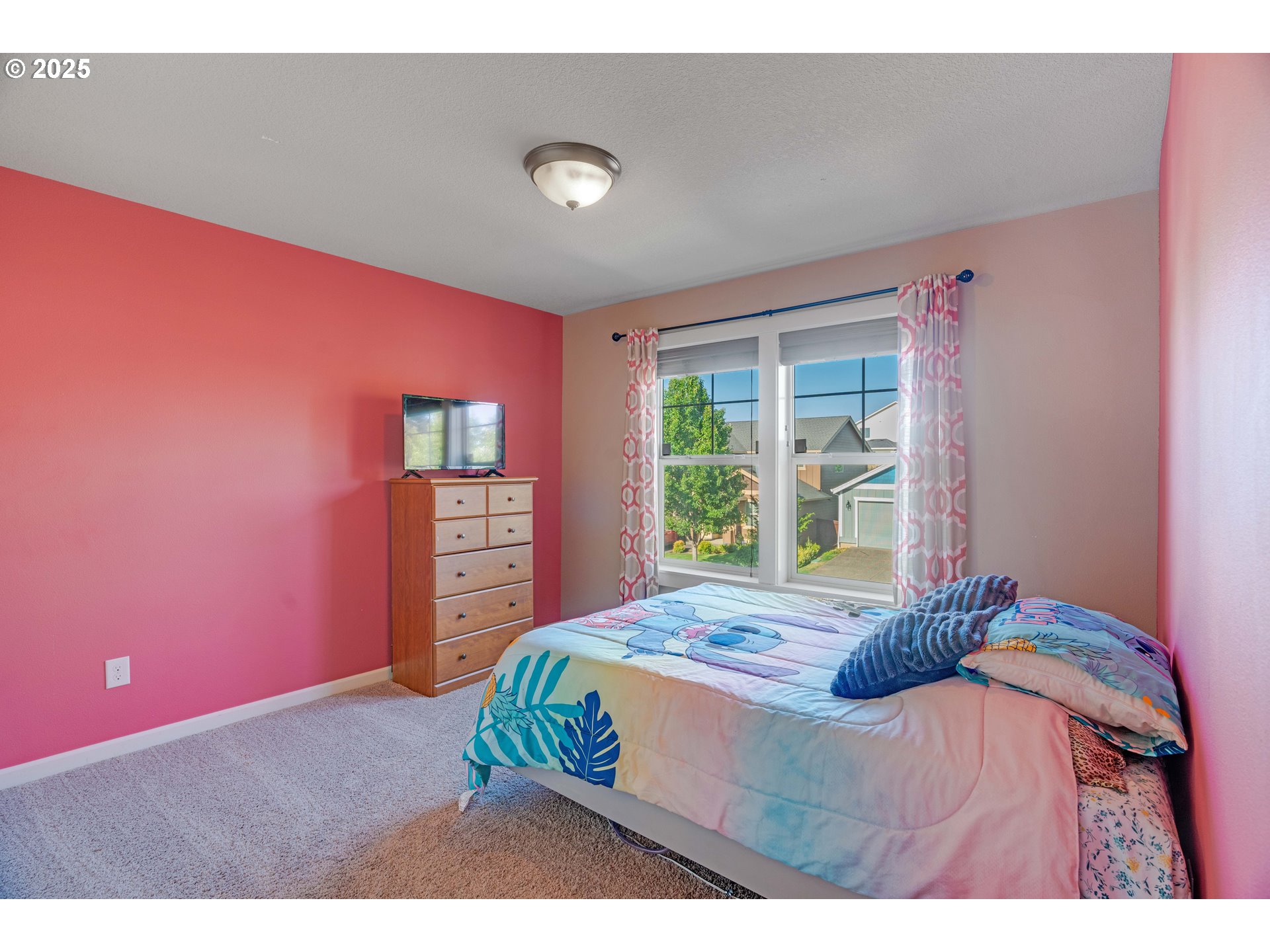 514 North 40th Avenue Ridgefield, WA 98642 - Photo 21 of 46 a bedroom with a bed and a window