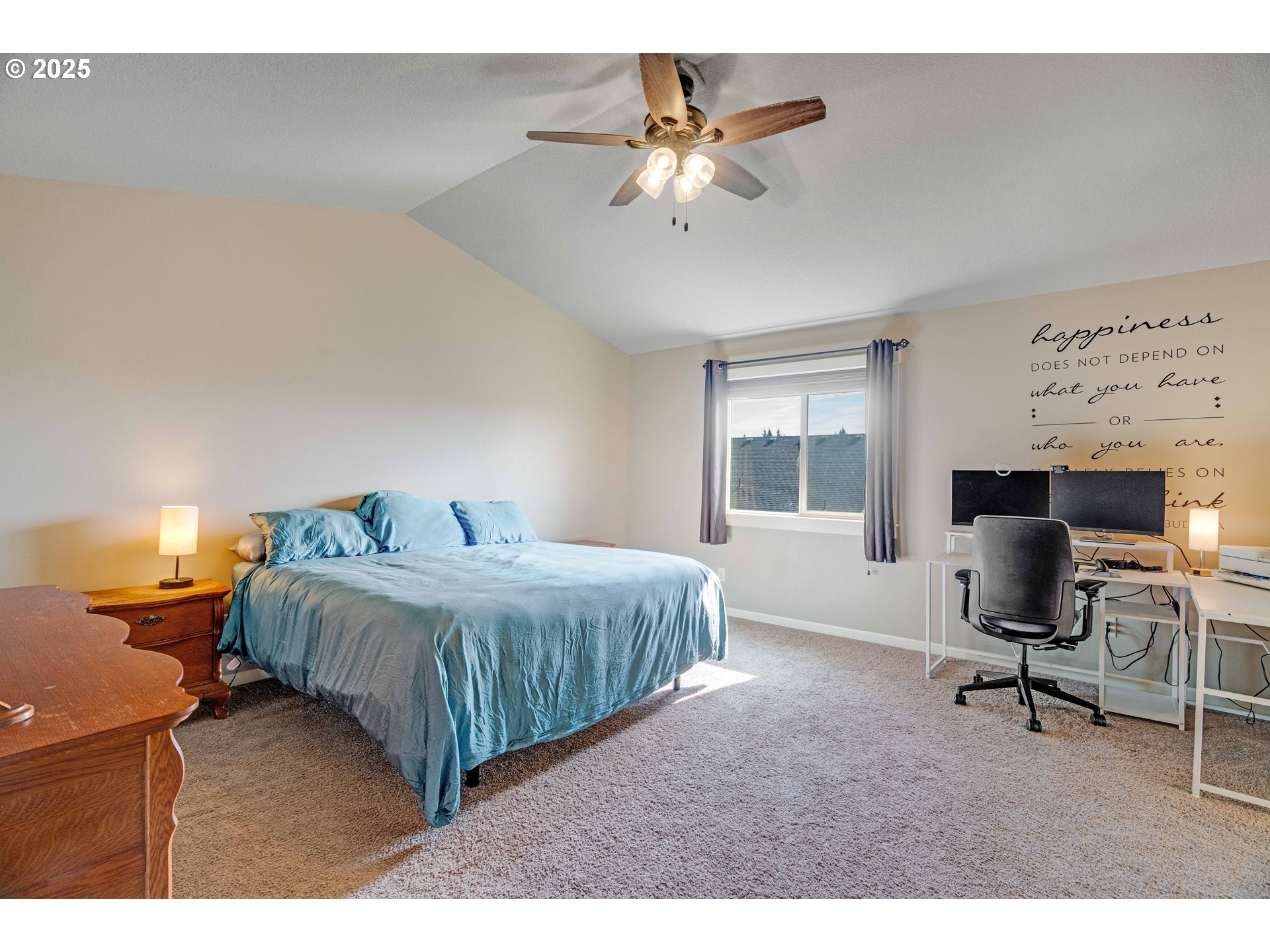 514 North 40th Avenue Ridgefield, WA 98642 - Photo 25 of 46 a bedroom with a bed a chair and a chandelier