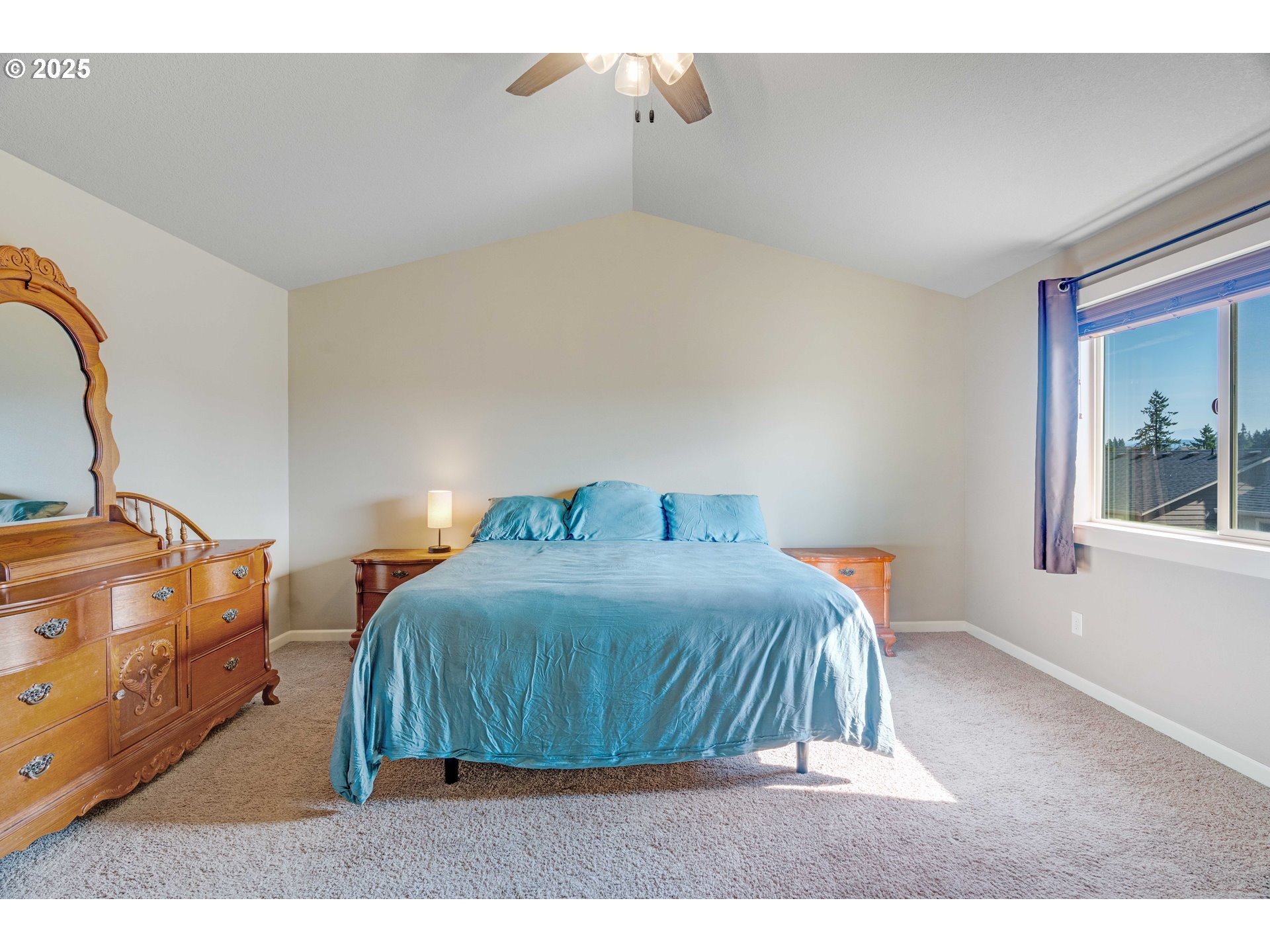 514 North 40th Avenue Ridgefield, WA 98642 - Photo 26 of 46 a bedroom with a bed and a painting on the wall