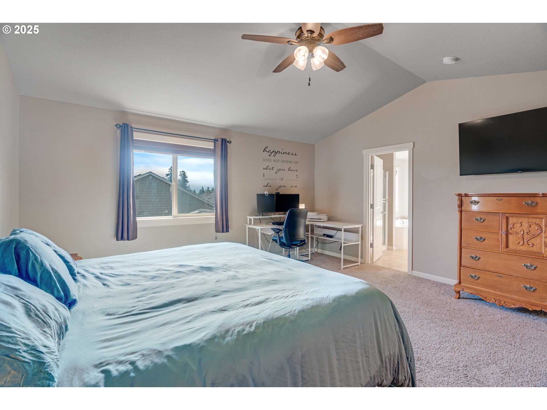 514 North 40th Avenue Ridgefield, WA 98642 - Photo 27 of 46 a bedroom with a bed and a flat screen tv