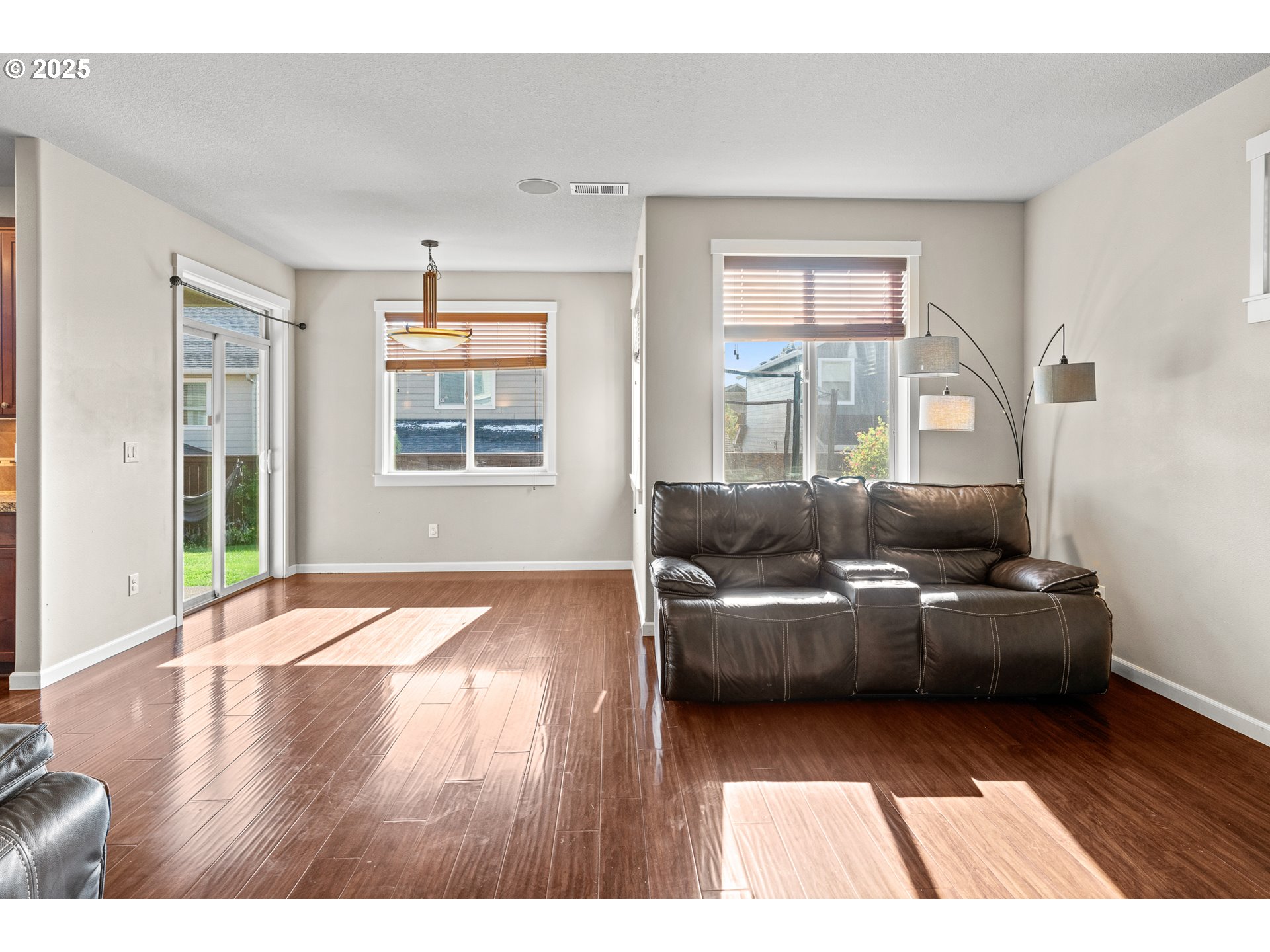 514 North 40th Avenue Ridgefield, WA 98642 - Photo 5 of 46 a living room with furniture and a wooden floor