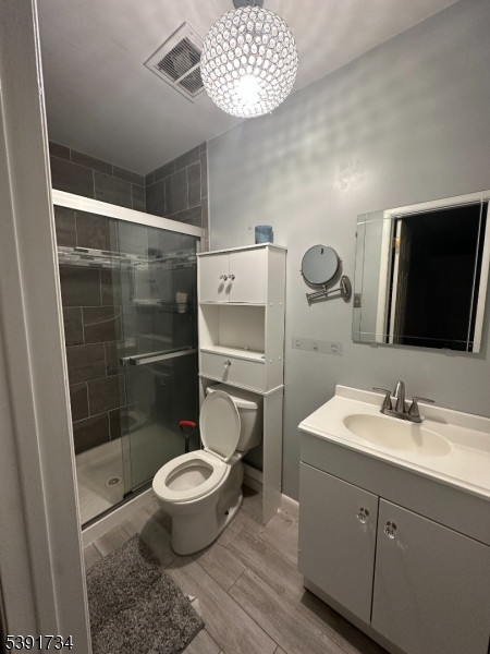 608 Robin Road Hillsborough, NJ 08844 - Photo 2 of 9 a bathroom with a toilet a sink and a mirror