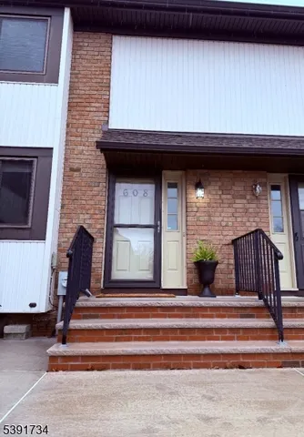 a view of entryway with a fireplace