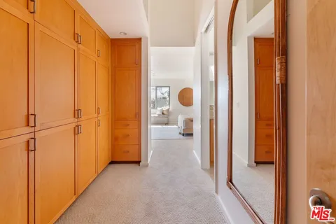 a bathroom with a granite countertop sink a mirror a vanity and shower