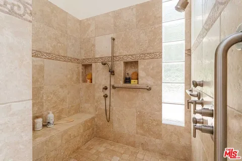 a bedroom with a bed and a desk