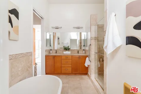 a bedroom with a bed and a cabinets