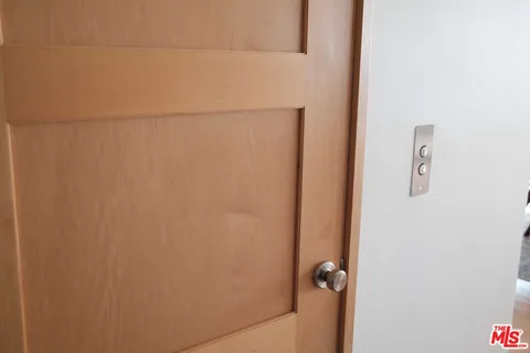 a view of a patio with a table and chairs and a fire pit