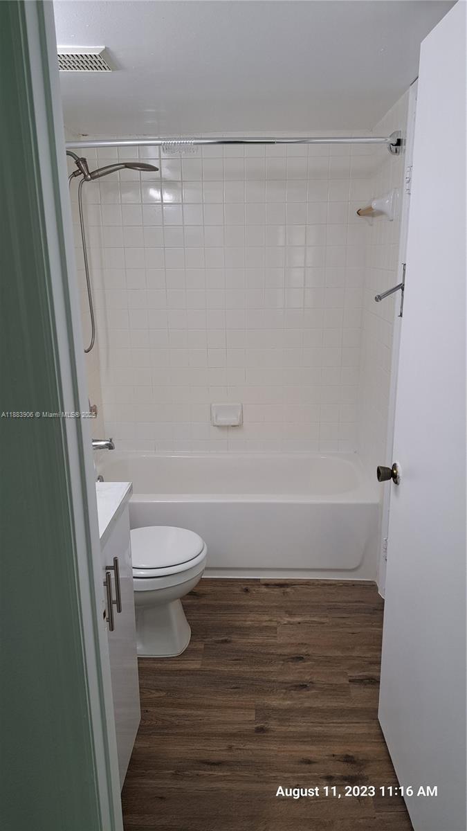15770 Southwest 106th Terrace, Unit 104 Miami, FL 33196 - Photo 18 of 30 a bathroom with a toilet and a shower