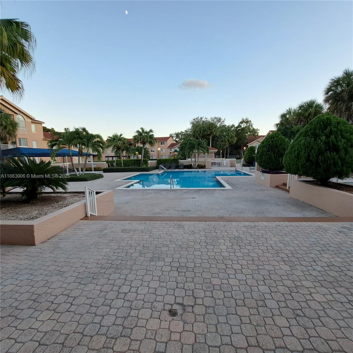 15770 Southwest 106th Terrace, Unit 104 Miami, FL 33196 - Photo 22 of 30 a view of street with lots of car parked on road