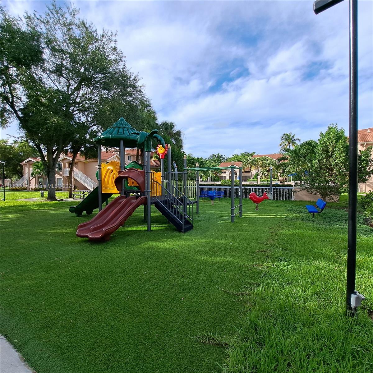 15770 Southwest 106th Terrace, Unit 104 Miami, FL 33196 - Photo 24 of 30 a view of a park with slide
