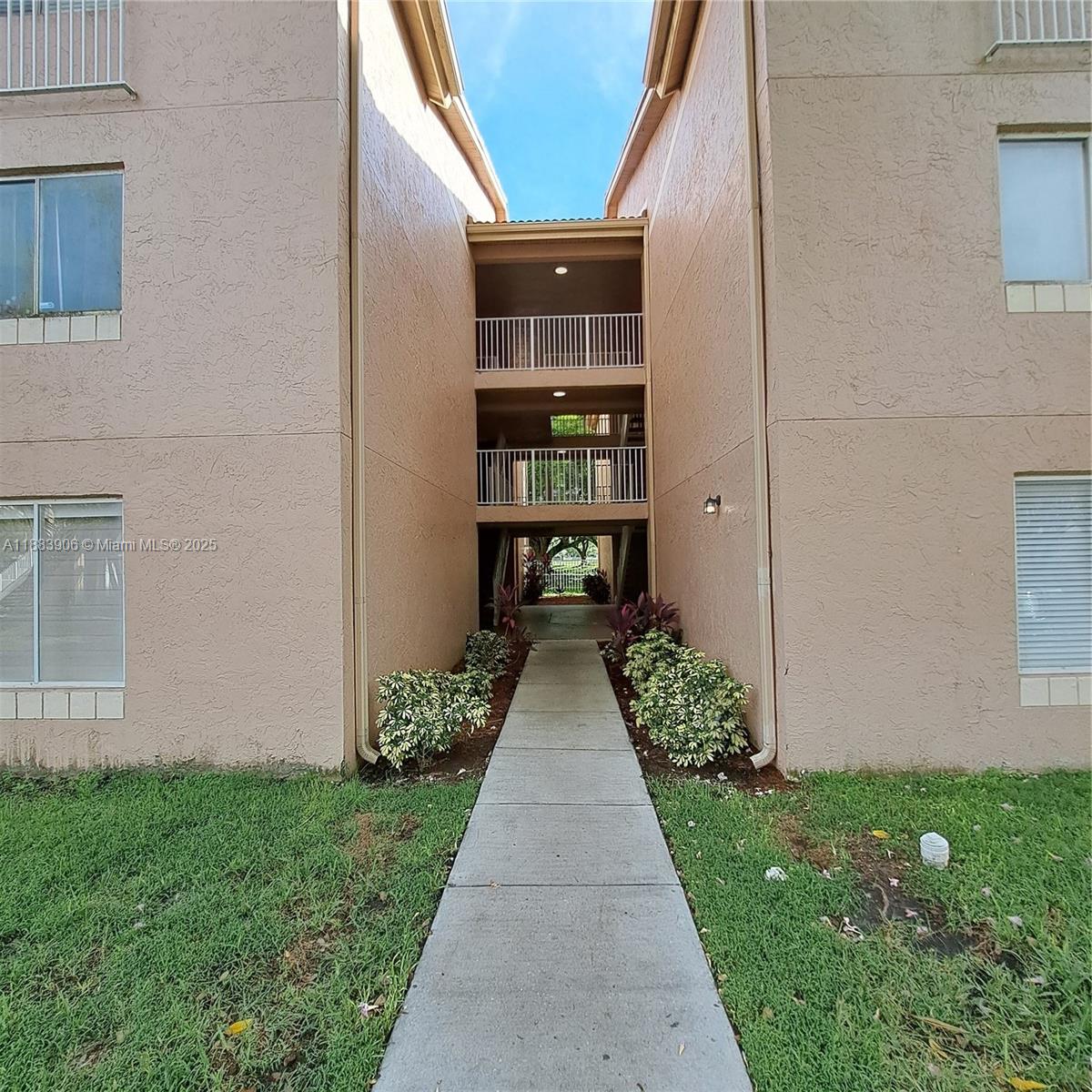 15770 Southwest 106th Terrace, Unit 104 Miami, FL 33196 - Photo 28 of 30 a view of a pathway both side of house and yard