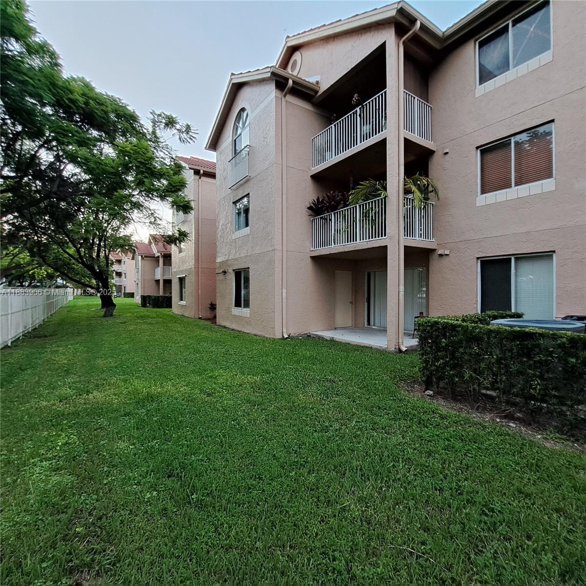 15770 Southwest 106th Terrace, Unit 104 Miami, FL 33196 - Photo 29 of 30 a view of a house with a yard