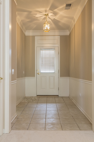 2434 Rolling Ridge Elgin, IL 60124 - Photo 2 of 17 a view of an empty room with window and chandelier fan