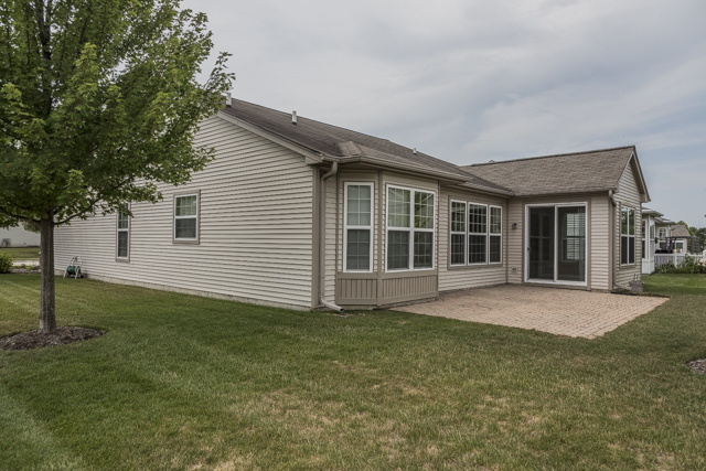 2434 Rolling Ridge Elgin, IL 60124 - Photo 16 of 17 a view of a house with a garden