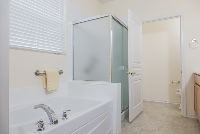 2434 Rolling Ridge Elgin, IL 60124 - Photo 10 of 17 a bathroom with a tub and shower