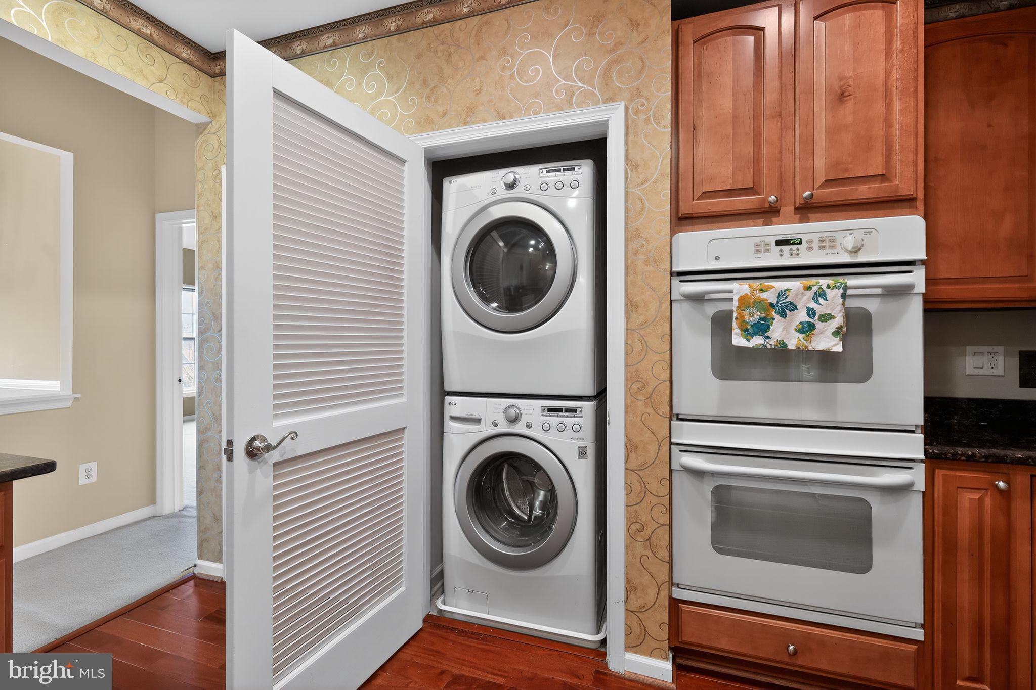 2007 Connor Court, Unit 701J Bowie, MD 20721 - Photo 12 of 15 a view of a storage and utility room with washer and dryer