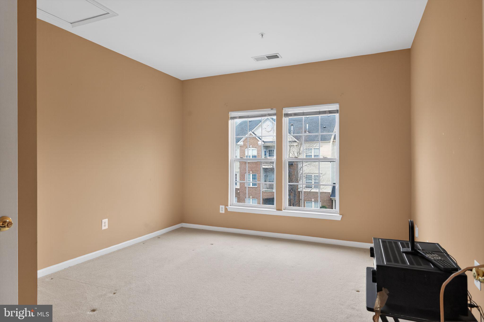 2007 Connor Court, Unit 701J Bowie, MD 20721 - Photo 14 of 15 a view of an empty room with a window